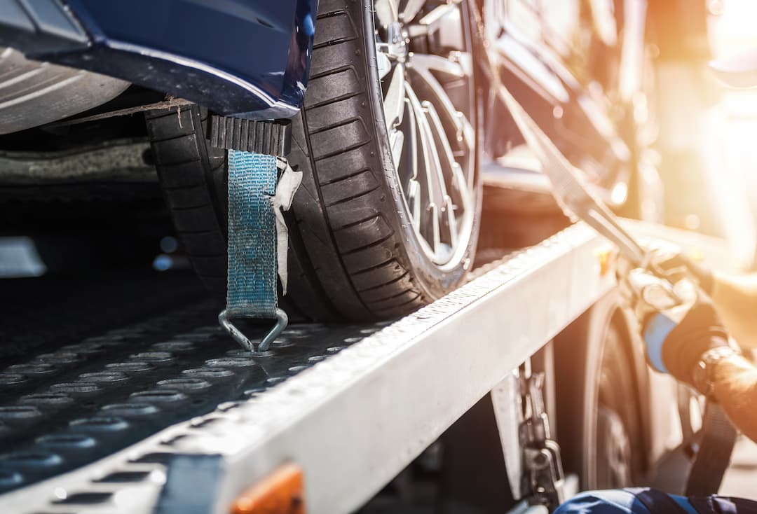 Car safely fastened on towing truck