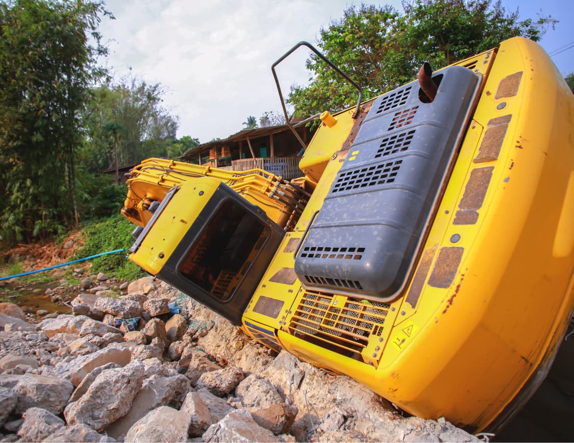 Tipped over excavator