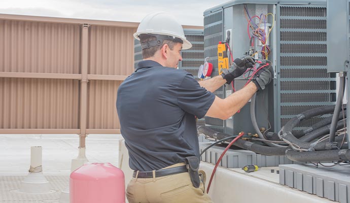 HVAC contractor working on a HVAC system